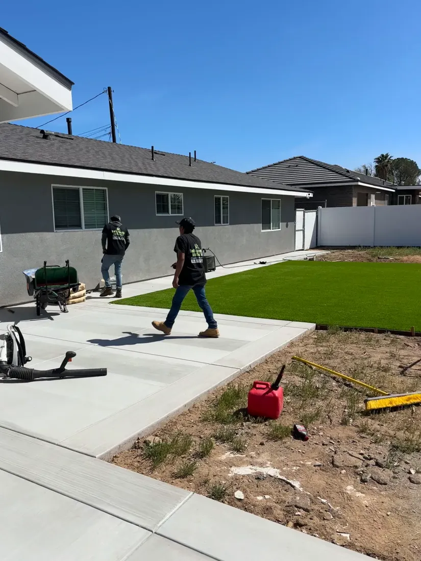 On-site progress beside a lawn and concrete area