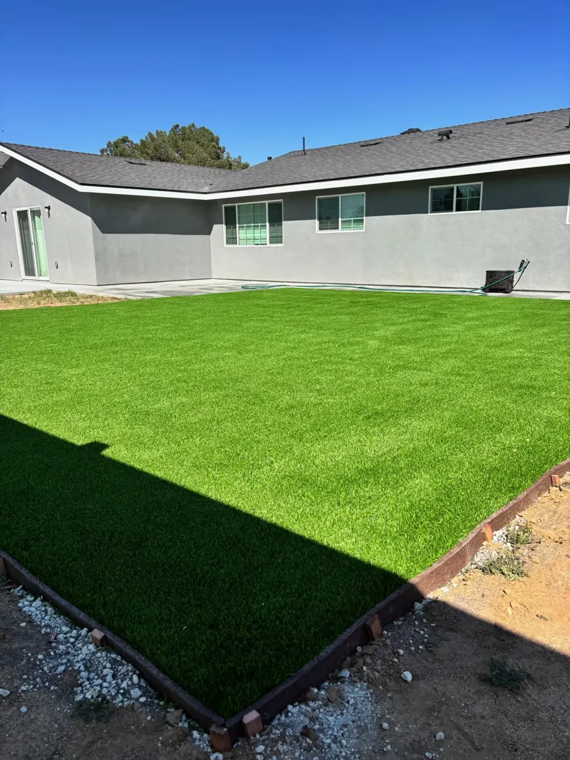 Green lawn area beside a home from the Canyon View project collection